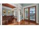 Elegant dining room with hardwood floors and French doors at 4941 Commonwealth Dr, Sarasota, FL 34242