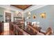 Dining room featuring light blue walls, wood ceiling, and built-ins at 4941 Commonwealth Dr, Sarasota, FL 34242