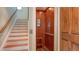 Home elevator featuring wood paneling conveniently located next to a staircase at 4941 Commonwealth Dr, Sarasota, FL 34242