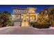 Beautiful multi-story home with balconies, a brick driveway, lush landscaping, and a two-car garage at 4941 Commonwealth Dr, Sarasota, FL 34242