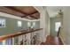 Bright hallway with bamboo ceiling, white trim, and a stained-glass decorative panel at 4941 Commonwealth Dr, Sarasota, FL 34242