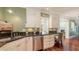 Kitchen with granite countertops, stainless steel appliances, and a view into another room at 4941 Commonwealth Dr, Sarasota, FL 34242