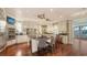 Spacious gourmet kitchen featuring an island with seating, granite counters, and stainless steel appliances at 4941 Commonwealth Dr, Sarasota, FL 34242