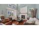 Bright and airy living room with a decorative fireplace and coastal decor at 4941 Commonwealth Dr, Sarasota, FL 34242