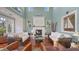 Bright living room with a decorative fireplace and lots of natural light at 4941 Commonwealth Dr, Sarasota, FL 34242