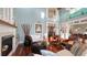 Bright and airy living room featuring a decorative fireplace and an open floor plan at 4941 Commonwealth Dr, Sarasota, FL 34242