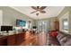 Cozy office features hardwood floors, stylish furnishings, and a balcony that has scenic views at 4941 Commonwealth Dr, Sarasota, FL 34242