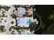 Aerial view of waterfront home, with private boat lift and beautiful swimming pool at 511 Bayview Dr, Holmes Beach, FL 34217