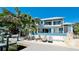 This stunning waterfront home has a private dock, outdoor seating and luxurious pool at 511 Bayview Dr, Holmes Beach, FL 34217