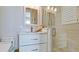 Bathroom with a modern vanity, quartz countertop, and glass-enclosed shower at 511 Bayview Dr, Holmes Beach, FL 34217