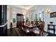 Formal dining room with a chandelier, a large table, and beautiful hardwood floors at 511 Bayview Dr, Holmes Beach, FL 34217