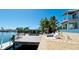 Dock and waterfront area perfect for relaxing, featuring lounge chairs and an inviting pool nearby at 511 Bayview Dr, Holmes Beach, FL 34217