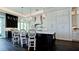 Elegant kitchen featuring an island with seating and custom cabinetry at 511 Bayview Dr, Holmes Beach, FL 34217