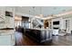 Spacious kitchen with a large island, modern appliances, and dark wood floors at 511 Bayview Dr, Holmes Beach, FL 34217