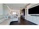 Open-concept living room features a large TV, built-in cabinets, and plenty of space at 511 Bayview Dr, Holmes Beach, FL 34217