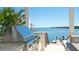 Outdoor stainless steel BBQ grill overlooking a beautiful water view for outdoor dining at 511 Bayview Dr, Holmes Beach, FL 34217