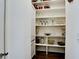 Organized pantry featuring shelving with various food and decorative items at 511 Bayview Dr, Holmes Beach, FL 34217