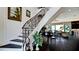 Ornate staircase leading to the living area, with dark wood floors and light walls at 511 Bayview Dr, Holmes Beach, FL 34217