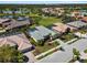 Aerial view of the home showcasing the roof, pool, landscaping, and neighborhood at 5270 White Ibis Dr, North Port, FL 34287