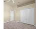Spacious bedroom with plush carpeting and a closet for storage at 5270 White Ibis Dr, North Port, FL 34287