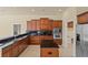 Gourmet kitchen with stainless steel appliances, granite countertops, and ample cabinet space at 5270 White Ibis Dr, North Port, FL 34287