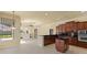Stylish kitchen with stainless steel appliances, granite counters, island, and access to living areas at 5270 White Ibis Dr, North Port, FL 34287