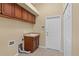 Practical laundry room with ample cabinet space and a utility sink at 5270 White Ibis Dr, North Port, FL 34287