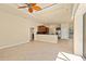 Bright living room offering tiled floors, a ceiling fan, and an open layout with kitchen views at 5270 White Ibis Dr, North Port, FL 34287