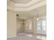 Spacious living room featuring neutral decor and an elegant chandelier with tile floors at 5270 White Ibis Dr, North Port, FL 34287
