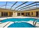 Inviting screened-in pool area with a sparkling pool and spacious patio at 5270 White Ibis Dr, North Port, FL 34287
