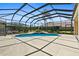 Inviting screened-in pool area with a sparkling pool and spacious patio at 5270 White Ibis Dr, North Port, FL 34287
