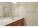 Bright bathroom featuring a solid surface vanity with ample cabinet storage at 5450 Soapstone Pl # 9-103, Sarasota, FL 34233