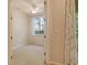 Bedroom featuring neutral walls, carpet, ceiling fan and natural light from the window at 5450 Soapstone Pl # 9-103, Sarasota, FL 34233