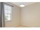 Bedroom with a window, blinds, neutral color, and a hanging light at 5450 Soapstone Pl # 9-103, Sarasota, FL 34233