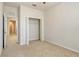 Cozy bedroom showing a closet with bifold doors and neutral walls and carpet at 5450 Soapstone Pl # 9-103, Sarasota, FL 34233