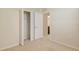 Bright bedroom featuring a closet with ample storage space and neutral carpeting at 5450 Soapstone Pl # 9-103, Sarasota, FL 34233