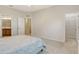 Bedroom features bathroom and closet entrances at 5450 Soapstone Pl # 9-103, Sarasota, FL 34233