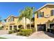 Charming two-story townhomes featuring well-manicured landscaping and attached garages at 5450 Soapstone Pl # 9-103, Sarasota, FL 34233