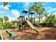 Well-equipped community playground with multiple slides, climbing features, and nearby benches for relaxation at 5450 Soapstone Pl # 9-103, Sarasota, FL 34233