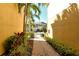 Beautiful walkway with tropical landscaping leading to the townhomes at 5450 Soapstone Pl # 9-103, Sarasota, FL 34233