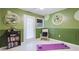 Unique flex room with green accent walls, shelving, and space for exercise at 5671 Osprey Rd, Venice, FL 34293