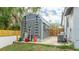 A shed on a property shows storage space and features including ladders, tools, and landscaping gear at 5671 Osprey Rd, Venice, FL 34293