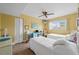 Cozy bedroom with twin beds, a desk area, and ample natural light at 6002 Oak Creek Ln # 1925, Bradenton, FL 34210