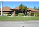 A charming clubhouse with a symmetrical design and tropical landscaping at 6002 Oak Creek Ln # 1925, Bradenton, FL 34210