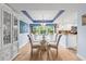 Charming dining area featuring a glass table, six chairs, and a beautiful blue accent design at 6002 Oak Creek Ln # 1925, Bradenton, FL 34210