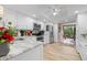 Modern kitchen features stainless steel appliances, granite countertops, and convenient access to the outdoor space at 6002 Oak Creek Ln # 1925, Bradenton, FL 34210