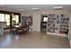 Community library with bookshelves and a table at 6002 Oak Creek Ln # 1925, Bradenton, FL 34210