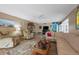 Inviting living room featuring a ceiling fan, comfortable seating, and tile floors at 6002 Oak Creek Ln # 1925, Bradenton, FL 34210