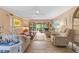 Bright living room with comfortable seating, ceiling fan and sliding glass doors to the outdoors at 6002 Oak Creek Ln # 1925, Bradenton, FL 34210