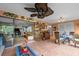 Open sunroom with dining area and bar, seamlessly connecting to the living space at 6002 Oak Creek Ln # 1925, Bradenton, FL 34210